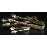 Three pairs of sugar tongs, to include a pair of George III silver shell and thread tongs, 1oz,