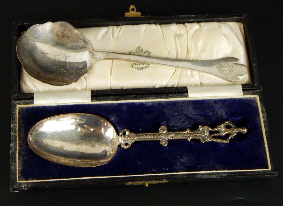 Two silver spoons, to include a trefid serving spoon, marked T.G.C. and bearing crest, Sheffield