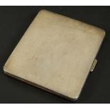 A George V silver cigarette case, with engine turned body, Birmingham 1933, 3½oz gross. (M)