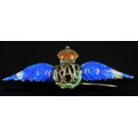A silver and enamel RAF brooch, with blue wings, red crown, and green crest, (AF), 4.3g all in. (M)