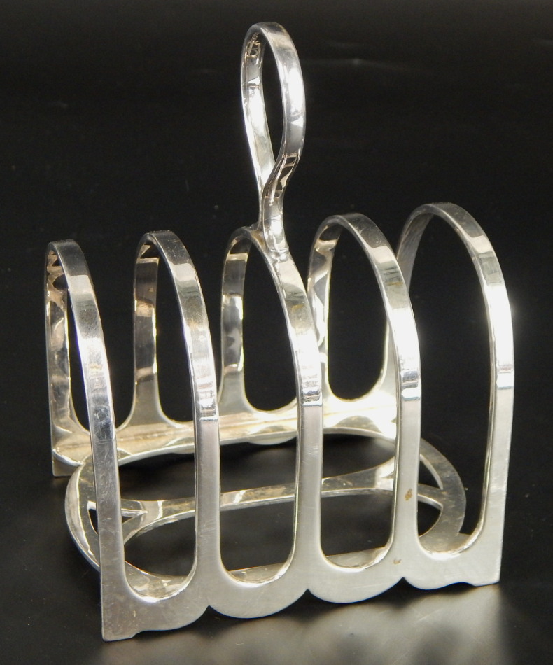 An Elizabeth II silver toast rack, of four bar design, Sheffield 1953, 6oz. (M)