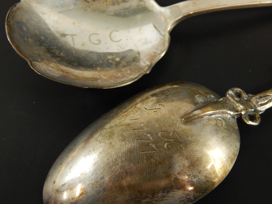 Two silver spoons, to include a trefid serving spoon, marked T.G.C. and bearing crest, Sheffield - Image 2 of 2