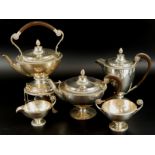 A George V silver five piece tea set, comprising coffee pot, 23cm high, teapot, 18cm high, tea