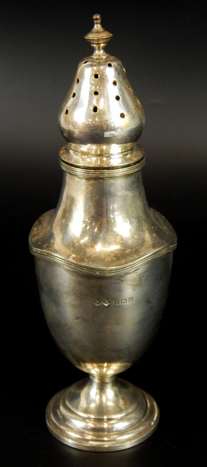 A George V silver pepperette, with stepped circular base, Birmingham 1927, 19cm high, 6oz. (M)