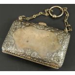 A George V silver coin purse, with foliate design, and leather interior, 2½oz. (M)