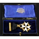 A Masonic medal by Spencer & Co of London, the white enamel cross surrounded by gilt metal lions,