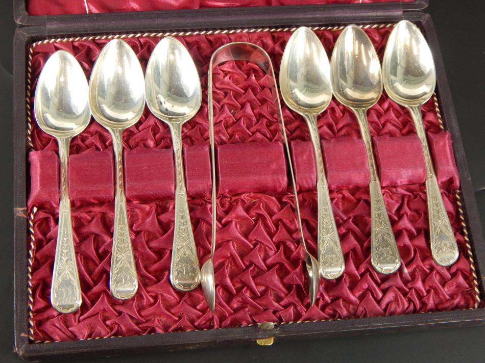 A cased set of silver teaspoons and sugar tongs, with bright-cut engraving, and bearing crest B,