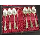 A cased set of silver teaspoons and sugar tongs, with bright-cut engraving, and bearing crest B,