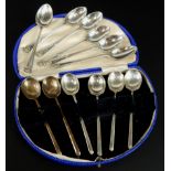 Two sets of silver teaspoons, comprising a set of lion mask silver teaspoons, and a cased set of six