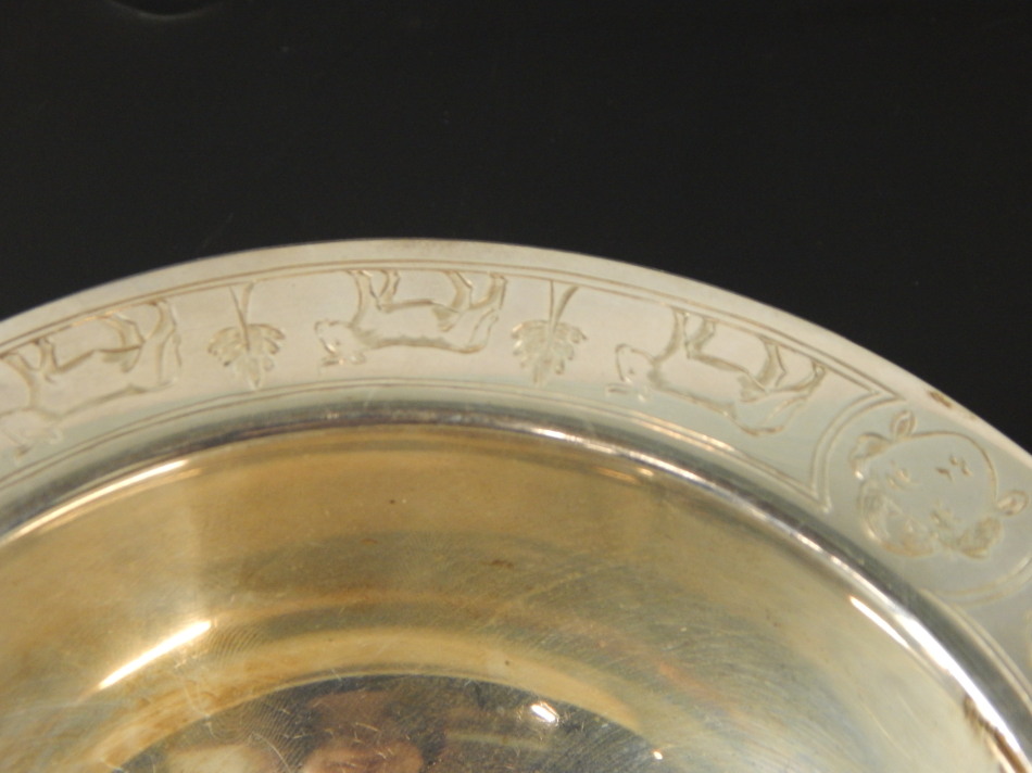 A George V silver dish, with design of animals and carts, Sheffield 1933, 8½oz, 14cm diameter. (M) - Image 2 of 3