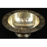 A George V silver dish, with design of animals and carts, Sheffield 1933, 8½oz, 14cm diameter. (M)