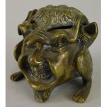 A late 19thC/early 20thC cast brass inkwell, modelled in the form of a grotesque figure, with two