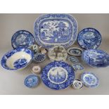 A collection of blue printed pottery, to include a large meat dish, an egg cup holder, Copeland