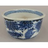 A Chinese blue and white jardiniere, decorated with figures, leaves etc., 14cm dia. (M)