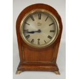 A late 19th/early 20thC mahogany and brass mantel clock, the silvered dial stamped K Maker, with