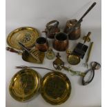 A collection of copper and brass, to include a pan with lid and iron handle, two similar matching