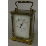 A late 19thC/early 20thC French brass carriage timepiece, with an enamelled dial, stamped Made in