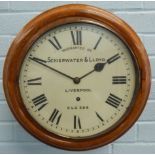 A late 19th/early 20thC oak railway wall clock, the white dial bearing inscription 'warranted by