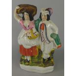 A Victorian Staffordshire flatback figure group, of a lady and a gentleman, 34cm high (M)