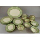 A quantity of Wedgwood dinnerware, with a green scroll printed border, (AF) (M)