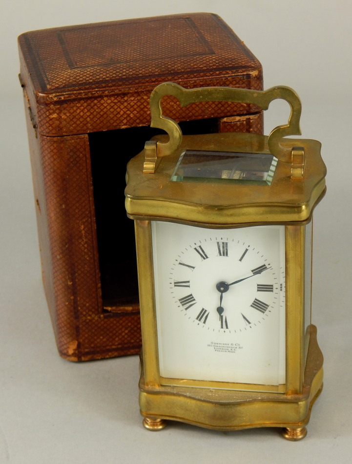 A 19thC French brass carriage timepiece, with white dial, and roman numerals, marked Stewart & Co