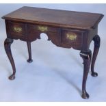 A 19thC oak lowboy, the top with a moulded edge above an arrangement of three drawers, on cabriole