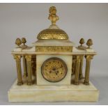 A late 19thC/early 20thC French onyx and gilt metal portico type mantel clock, with a gilt dial,