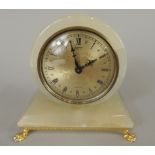 A late 20thC onyx mantel clock, the dial stamped Xavier, quartz, 13cm wide (M)