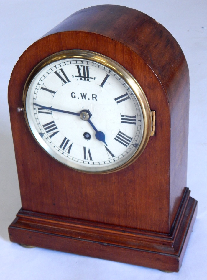 An early 20thC mahogany cased railway mantel clock, the white dial painted GWR, ivorine label to