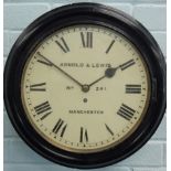 A late 19thC ebonised railway wall clock, the dial signed Arnold & Lewis, Manchester, number 241,