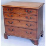 A George III mahogany chest of drawers, the top with a moulded edge above an arrangement of four