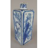 A 19thC Chinese square section vase, decorated in blue with birds seated on branches of flowering