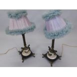 A pair of French gilt metal and marble table lamps, each with a lilac and turquoise coloured frilled