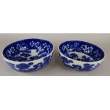 Two similar Copeland Spode's Tower pattern blue flow bowls, printed mark to underside, 23cm and 21.