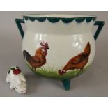 A Wemyss two handled jardiniere, decorated with chickens (AF) and a Plichta pig (M)