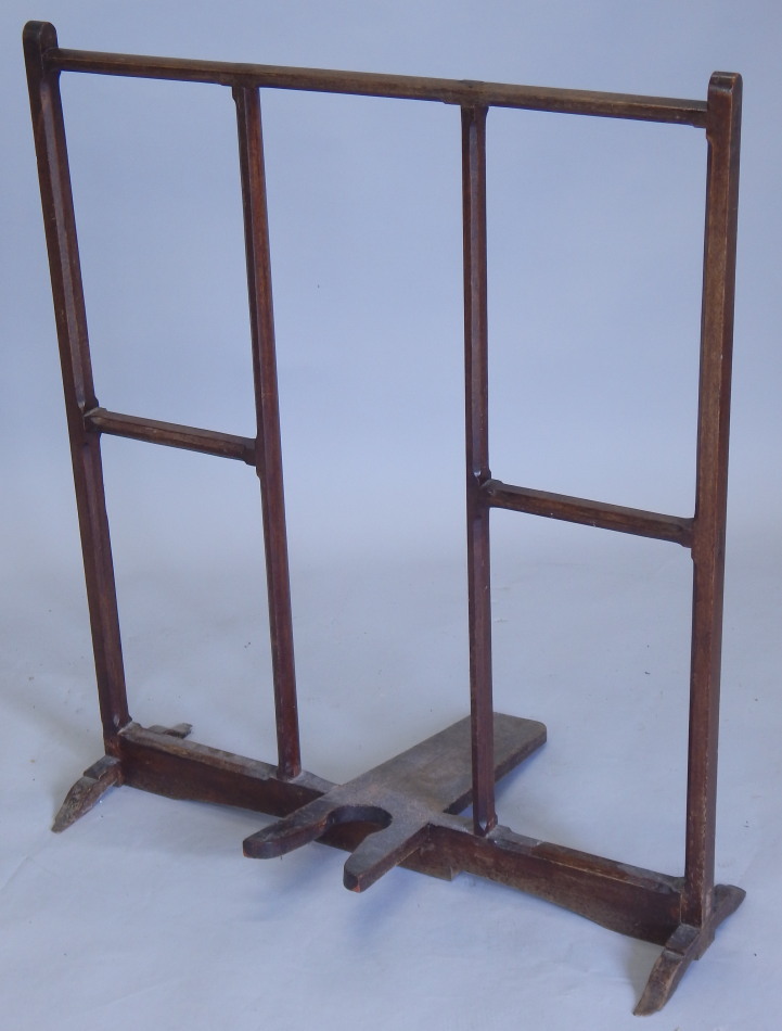 A 19thC mahogany bootjack, with chamfered rails on shaped feet (AF)76cm wide (M)