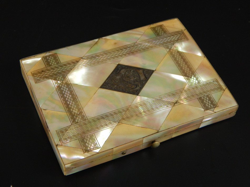 A 19thC mother of pearl card case, with central silver diamond shaped crest, with blue interior,