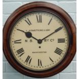 A late 19th/early 20thC mahogany railway wall clock, the white dial painted with the name T