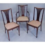 Three Edwardian mahogany and marquetry chairs, each with a pierced splat and a padded seat with