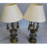 A pair of Continental gilt metal table lamps, each with four branches, suspended with chandelier