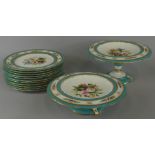 A Minton type porcelain dessert service, painted with flower sprays, within gilt and turquoise