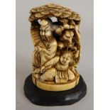 A late 19thC Japanese okimono, carved with figures etc., signature mark to underside, 7cm high (M)