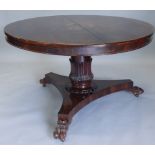 An early Victorian rosewood breakfast table, the circular top on a leaf carved cylindrical column