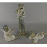 A collection of Lladro, to include a figure of a boy with a kid and two angels (M)