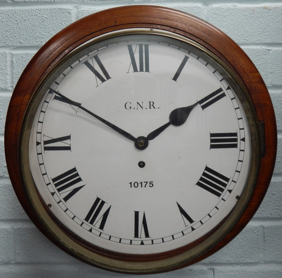 A late 19th/early 20thC mahogany railway wall clock, the dial painted GNR, numbered 10175, with