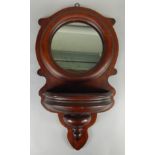 A late 19thC mahogany wall pocket or wall mirror, with a bow fronted receptacle, 67cm x 38cm (M)