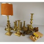 A collection of metalware, to include various 19thC and later brass candlesticks and a brass lock (