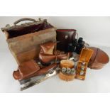 A quantity of leather items, to include a Gladstone bag, leather ice skates, a collar box, a