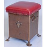 An early 20thC copper Art Nouveau style coal box, with a red leatherette padded seat, two handles,