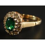 A 9ct gold cluster ring, set with green and white stones, 2.5g all in.